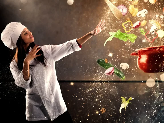 Chef Waving Magically Over Floating Cooking Items and Food