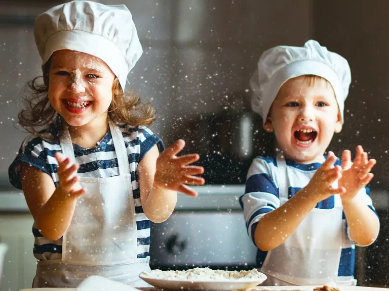 Two Children Messy with Flour Cooking